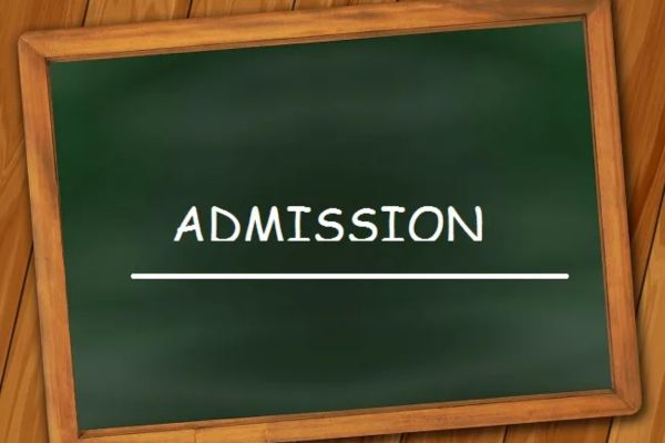 A wooden-framed blackboard displays "ADMISSION" in white chalk, with a horizontal underline below the text.